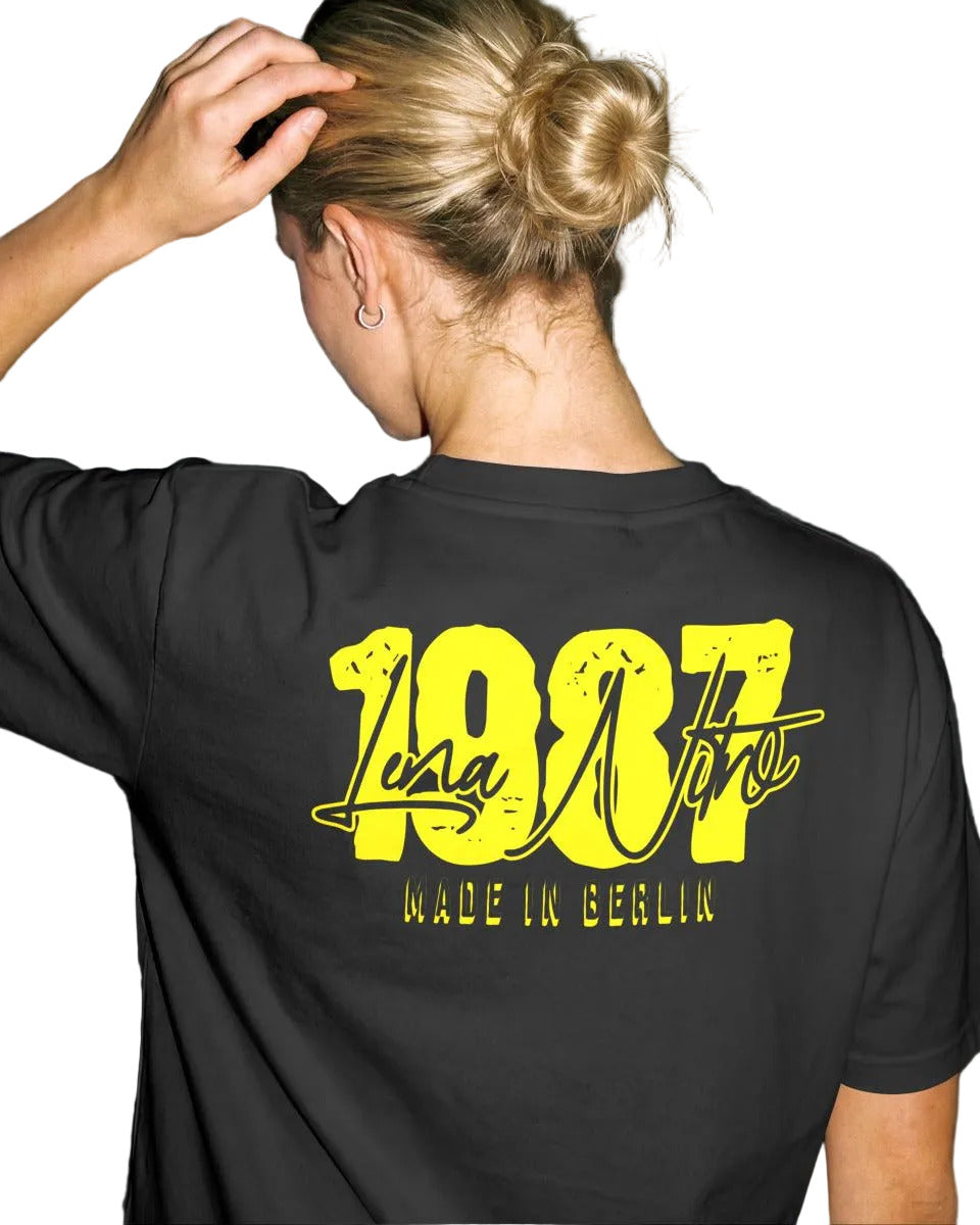 Lena Nitro 1987 Berlin yellow graphic tee back view