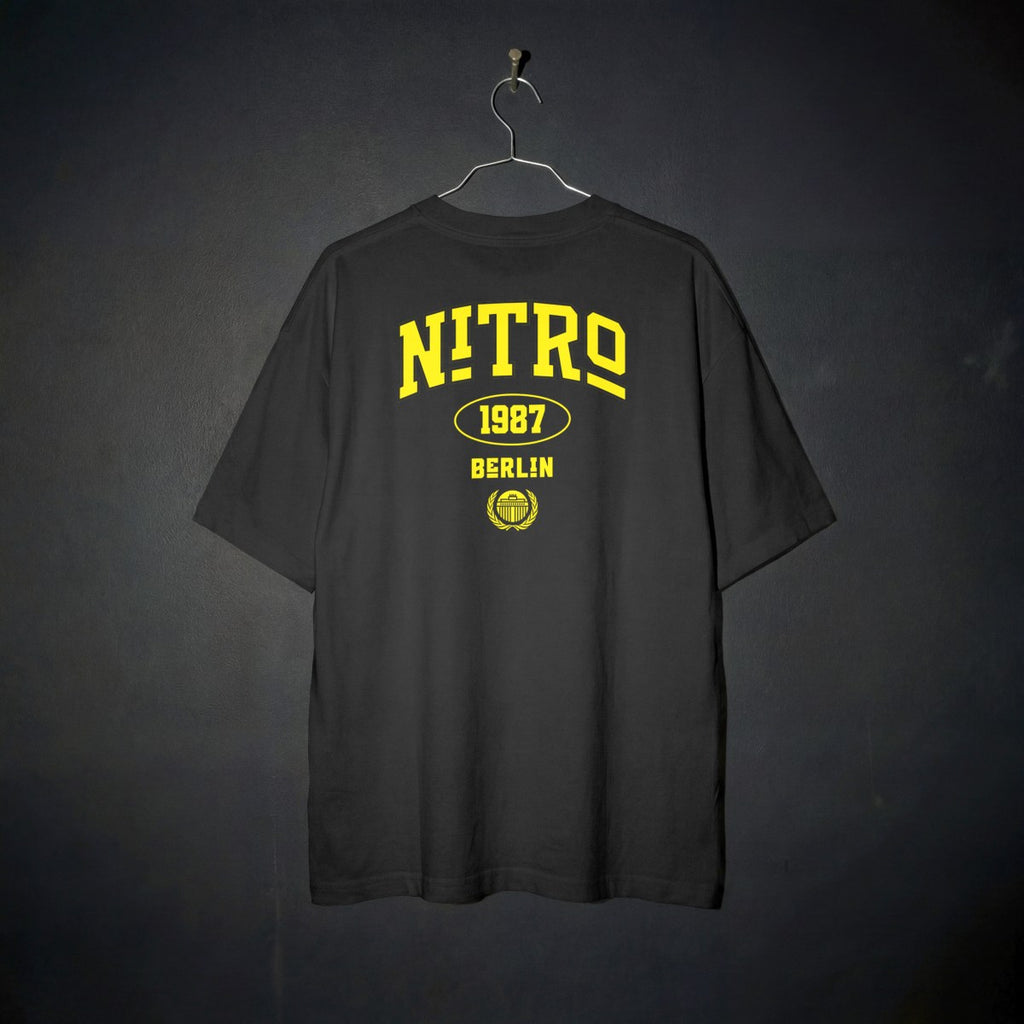 Back view of Lena Nitro Berlin yellow typography shirt