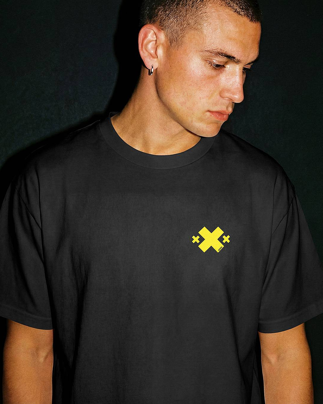 Male model wearing black Nitroarmy shirt with yellow logo